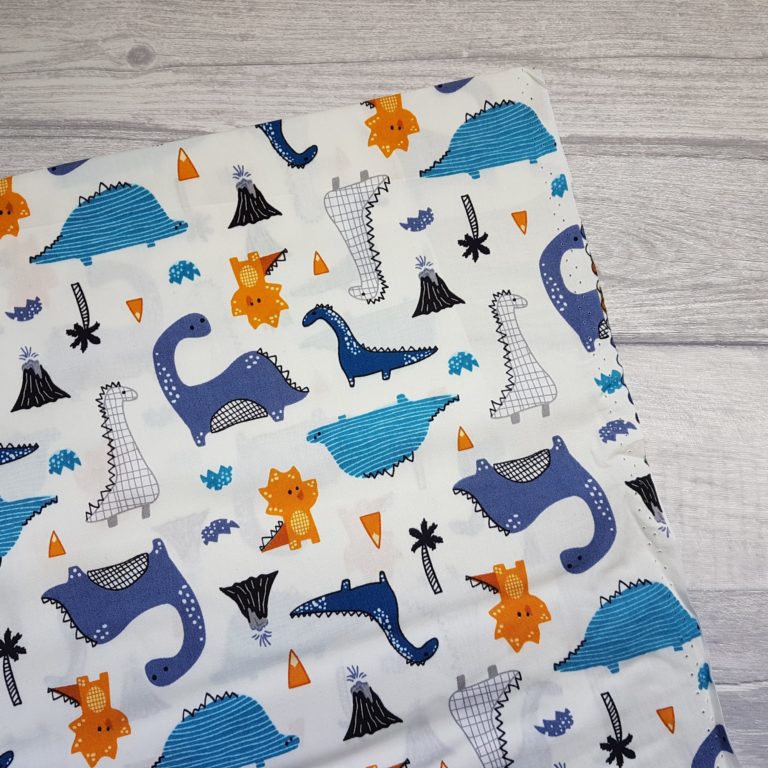Dinosaurs on Ivory Cotton Poplin Print Fabric | Caboodle Textiles