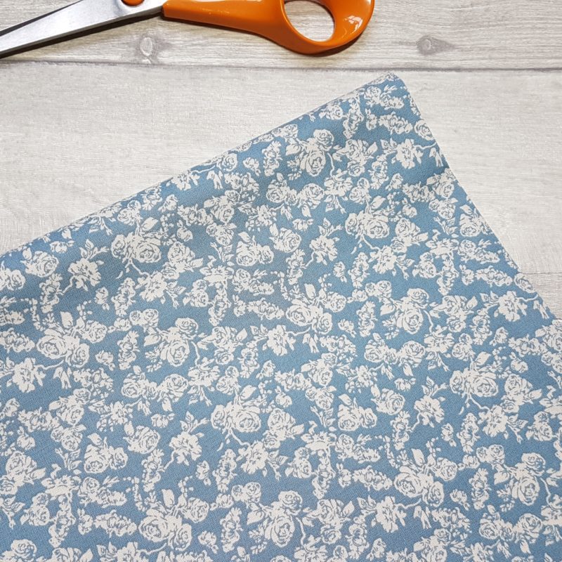 Delicate Rose on Blue Cotton Fabric