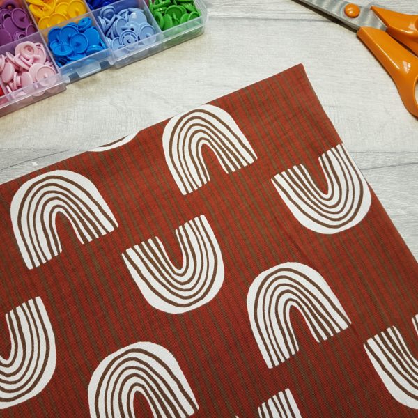 Sketched Rainbow Brick Red Jersey Knit Fabric
