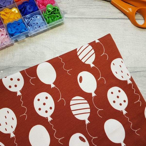Balloons Brick Red Jersey Knit Fabric