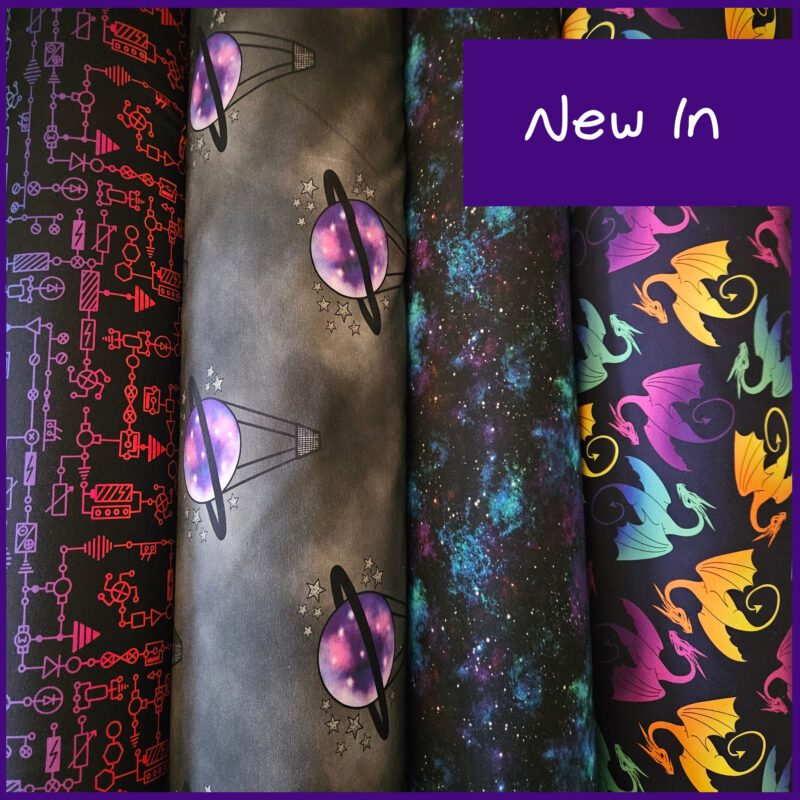 rolls of fabrics show the latest printed fabrics, circuits, night ride, vibrant galaxy and ombre dragons